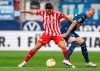 Berlin's Rani Khedira, left, and Bochum's Philipp Hofmann, right, challenge for the ball during the German Bundesliga soccer match between VfL Bochum and 1. FC Union Berlin in Bochum, Germany, Sunday, Oct 23, 2022. (David Inderlied/dpa via AP)