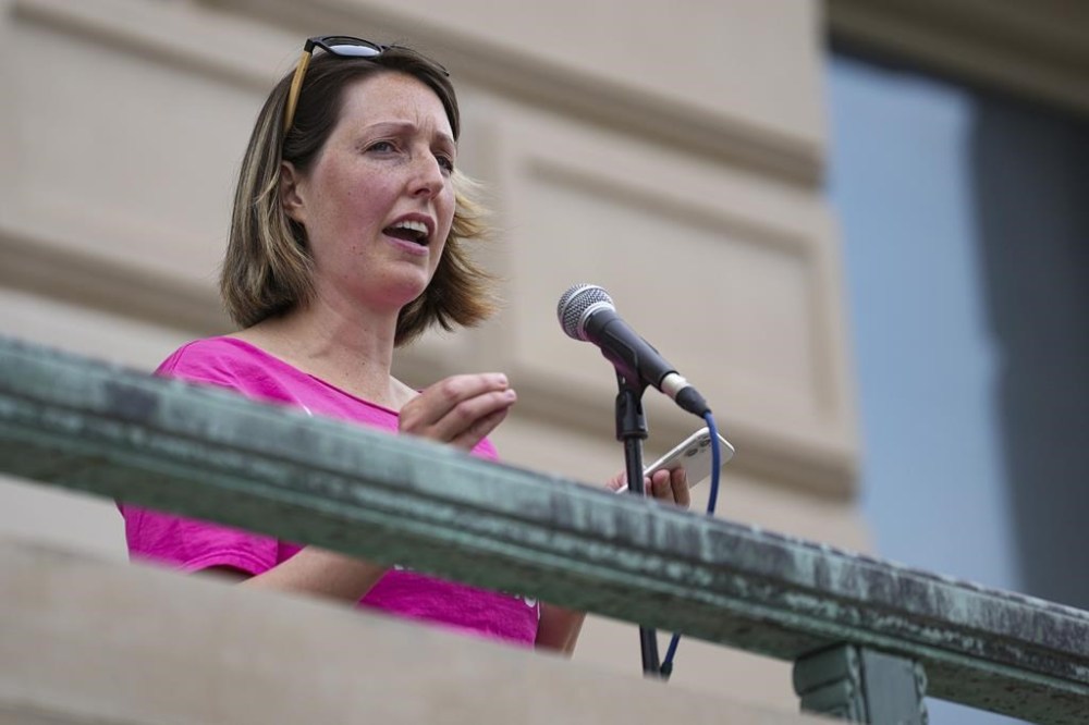 FILE - Dr. Caitlin Bernard, a reproductive healthcare provider, speaks during an abortion rights rally on June 25, 2022, at the Indiana Statehouse in Indianapolis. The Indianapolis doctor who performed an abortion on a 10-year-old rape victim from Ohio is suing Indiana's attorney general Thursday, Nov. 3, 2022, seeking to block him from using allegedly “frivolous
