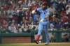 Philadelphia Phillies' Brandon Marsh tosses his bat after getting hit by a pitch during the sixth inning in Game 5 of baseball's World Series between the Houston Astros and the Philadelphia Phillies on Thursday, Nov. 3, 2022, in Philadelphia. (AP Photo/David J. Phillip)