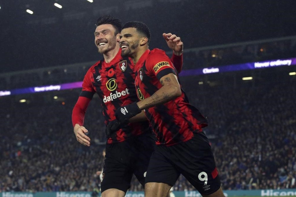 Bournemouth's Dominic Solanke, right, celebrates with Kieffer Moore after scoring his side's third goal of the game, during the English Premier League soccer match between Leeds United and Bournemouth, at Elland Road, in Leeds, England, Saturday, Nov. 5, 2022. (Ian Hodgson/PA via AP)