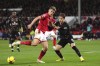 Nottingham Forest's Ryan Yates, left, and Brentford's Mathias Jensen battle for the ball during the English Premier League soccer match at the City Ground, Nottingham, England, Saturday Nov. 5, 2022. (John Walton/PA via AP)