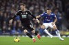 Leicester City's James Maddison, left and Everton's Vitaliy Mykolenko battle for the ball, during the English Premier League soccer match between Everton and Leicester City at Goodison Park, in Liverpool, England, Saturday, Nov. 5, 2022. (Isaac Parkin/PA via AP)