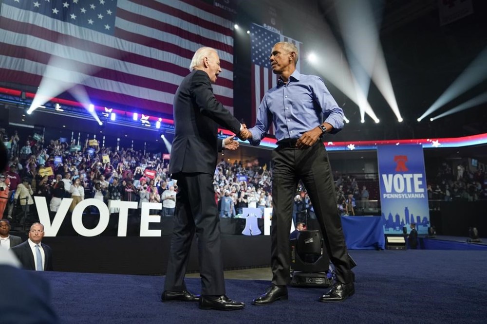 President Joe Biden and former President Barack Obama shake hands at a campaign rally for Pennsylvania's Democratic gubernatorial candidate Josh Shapiro and Democratic Senate candidate Lt. Gov. John Fetterman, Saturday, Nov. 5, 2022, in Philadelphia. (AP Photo/Patrick Semansky)