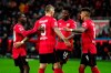 Leverkusen's Robert Andrich, second left, celebrates scoring with teammates Jeremie Frimpong, Edmond Tapsoba and Piero Hincapie during the Bundesliga soccer match between Bayer Leverkusen - 1. FC Union Berlin at BayArena, Leverkusen, Germany, Sunday Nov. 6, 2022. (Marius Becker/dpa via AP)