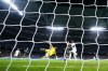 Real Madrid's Vinicius Junior, right, scores his side's fourth goal during the Champions League Group F soccer match between Real Madrid and Celtic at the Santiago Bernabeu stadium in Madrid, Spain, Wednesday, Nov. 2, 2022. (AP Photo/Manu Fernandez)