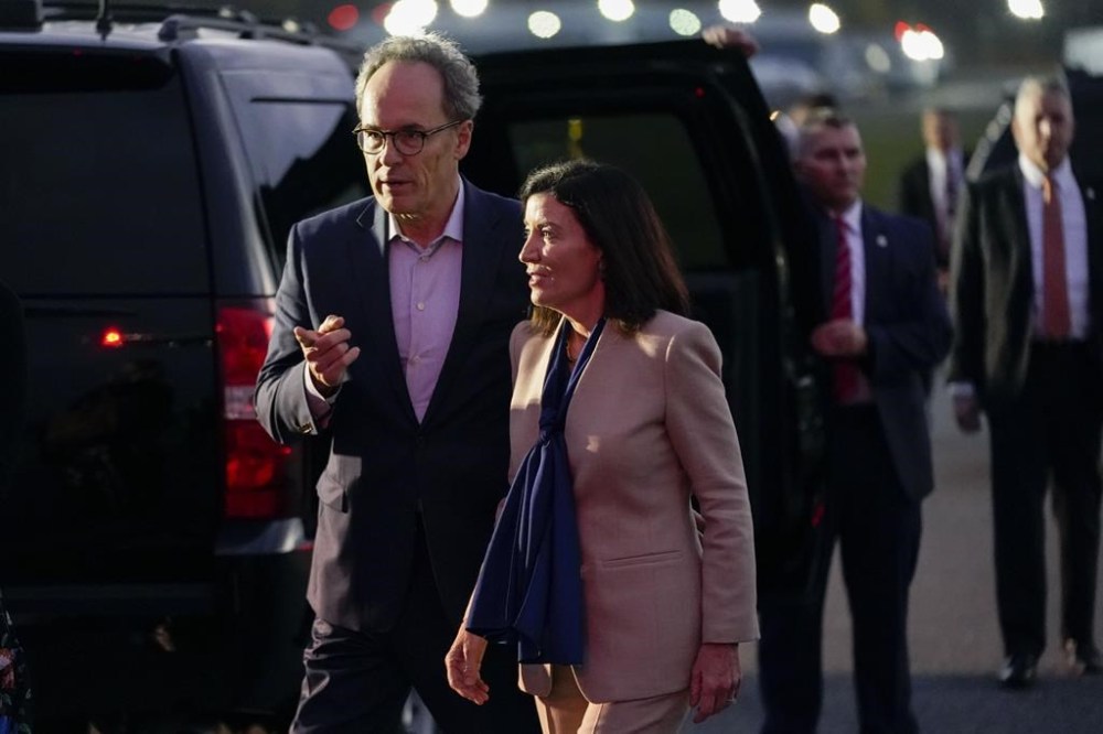 New York Gov. Kathy Hochul talks with her her husband William J. Hochul Jr. after greeting President Joe Biden, Sunday, Nov. 6, 2022, at Westchester County Airport in Westchester County, N.Y. (AP Photo/Patrick Semansky)