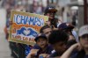 Elissa Rodriguez holds a sign as fans wait for a victory parade for the Houston Astros' World Series baseball championship Monday, Nov. 7, 2022, in Houston. (AP Photo/David Phillip)
