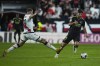 Real Madrid's Marco Asensio, right, vies for the ball with Rayo's Florian Lejeune during the Spanish La Liga soccer match between Rayo Vallecano and Real Madrid at the Vallecas stadium in Madrid, Monday, Nov. 7, 2022. (AP Photo/Manu Fernandez)
