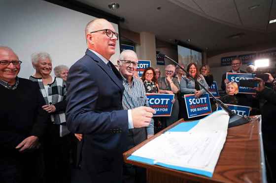 Scott Gillingham gives his grandfather, Gordon Alder, a hug during his victory speech. (Ruth Bonneville / Winnipeg Free Press)