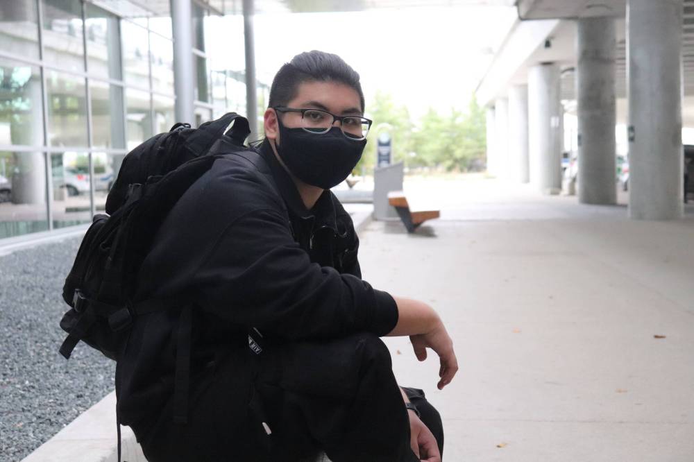 Kent Ledda, who works at a restaurant in the airport, says he flew once during the pandemic and experienced nausea while wearing his mask on the plane, so he understands why people might prefer to go unmasked. (Tyler Searle / Winnipeg Free Press)