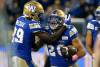 Winnipeg Blue Bombers’ Greg McCrae (29) and Brady Oliveira (20) celebrate Oliveira's touchdown against the Edmonton Elks during first half CFL action in Winnipeg Saturday, October 8, 2022. THE CANADIAN PRESS/John Woods
