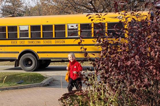 Jon Kovac's youngest son, Eddie, gets off the school bus on a recent autumn day. (Supplied)