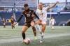 DANIEL CRUMP / WINNIPEG FREE PRESS
                                Bisons Jenna Kunkel (33) fends off Regina’s Kirsten Koellmel as the Univerisity of Manitoba takes on the University of Regina Cougars at IG Field Saturday