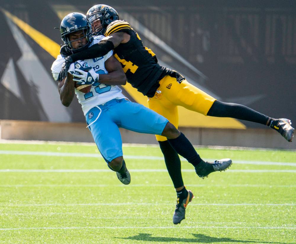 Peter Power / The Canadia Press files
DB Desmond Lawrence (right) wasn’t out of work for long after the Hamilton Tiger-Cats released him at the beginning of October.