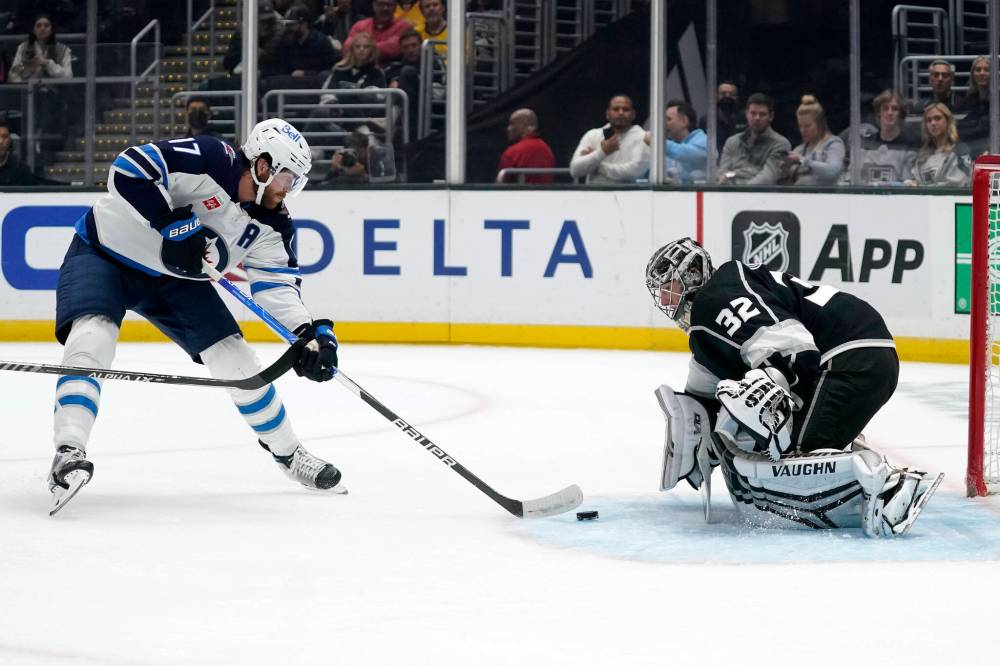 (AP Photo/Mark J. Terrill)
Winnipeg Jets centre Adam Lowry, left, scores on Los Angeles Kings goaltender Jonathan Quick during the first period Thursday in Los Angeles.