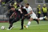 Chelsea's Reece James, right, fights for the ball with AC Milan's Ismael Bennacer, left, and Fikayo Tomori during the Champions League group E soccer match between AC Milan and Chelsea at the San Siro stadium in Milan, Italy, Tuesday, Oct. 11, 2022. (AP Photo/Antonio Calanni)