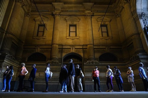 Voters wait in line to make corrections to their ballots for the midterm elections at City Hall in Philadelphia, Monday, Nov. 7, 2022. THE CANADIAN PRESS/AP, Matt Rourke