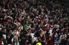 Rayo Vallecano supporters celebrate after Rayo's Santi Comesana scored the opening goal during the Spanish La Liga soccer match between Rayo Vallecano and Real Madrid at the Vallecas stadium in Madrid, Monday, Nov. 7, 2022. (AP Photo/Manu Fernandez)