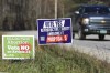 FILE - A truck drives by campaign signs opposing and supporting a proposed amendment to the Vermont constitution that would guarantee access to reproductive rights, including abortion, by the side of the road in on Nov. 3, 2022 in Middlesex, Vt. On Nov. 8 five more states will get a gauge of voter sentiment with about abortion, from deep-red Kentucky to purple Michigan to blue California. (AP Photo/Wilson Ring, File)