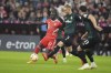 Bayern's Sadio Mane, centre, and Bremen's Amos Pieper, second from right, challenge for the ball during the Bundesliga soccer match between Bayern Munich and Werder Bremen at the Allianz Arena in Munich, Germany, Tuesday, Nov. 8, 2022. (AP Photo/Matthias Schrader)