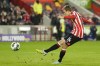 Brentford's Mikkel Damsgaard hits the bar with his penalty during the English League Cup third round soccer match between Brentford and Gillingham at Gtech Community stadium in London, Tuesday, Nov. 8, 2022. (AP Photo/Kirsty Wigglesworth)
