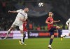 Marseille's Jordan Veretout, left, heads the ball ahead of Lyon's Malo Gusto during the French League One soccer match between Marseille and Lyon at the Velodrome stadium in Marseille, southern France, Sunday, Nov. 6, 2022. (AP Photo/Daniel Cole)