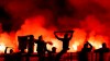 Cologne's fans set off pyrotechnics in the south stand, during the Bundesliga soccer match between Cologne and Bayer Leverkusen, in Cologne, Germany, Wednesday, Nov. 9, 2022. (Rolf Vennenbernd/dpa via AP)