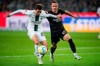Frankfurt's Mario Gotze, right, vies for the ball with Gladbach's Joe Scally, during the German Bundesliga soccer match between Monchengladbach and Eintracht Frankfurt at Borussia-Park Stadium, in Monchengladbach, Germany, Saturday, Oct. 22, 2022. (Marius Becker/dpa via AP)