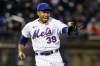 FILE - New York Mets relief pitcher Edwin Diaz (39) reacts after the final out in the first baseball game of a doubleheader against the Washington Nationals, o, Oct. 4, 2022, in New York. The Mets re-signed Díaz to a five-year contract, the team announced, Wednesday, Nov. 9, 2022. (AP Photo/Frank Franklin II, File)