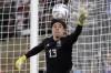 FILE - Mexico goalkeeper Guillermo Ochoa stops a shot during the second half of a soccer match against Peru Saturday, Sept. 24, 2022, in Pasadena, Calif. (AP Photo/Mark J. Terrill, File)