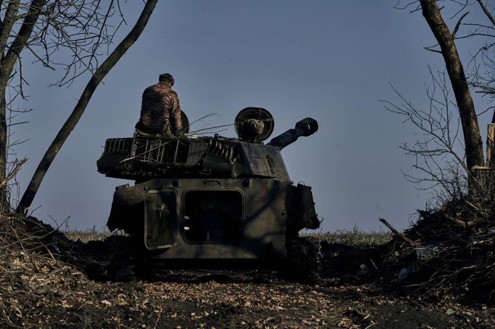 A self-propelled artillery vehicle prepares to fires near Bakhmut, Donetsk region, Ukraine, Wednesday, Nov. 9, 2022. (AP Photo/LIBKOS)