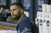FILE - Tampa Bay Rays outfielder Kevin Kiermaier gets ready in the dugout before a baseball game against the New York Yankees on June 20, 2022, in St. Petersburg, Fla. The Tampa Bay Rays have a declined a $13 million club option on Kiermaier for next season, triggering a $2.5 million buyout and making the defensive whiz a free agent on Thursday, Nov. 10. (AP Photo/Steve Nesius, File)