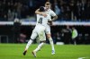 Real Madrid's Toni Kroos, right, celebrates with teammate David Alaba after scoring his side's second goal during Spanish La Liga soccer match between Real Madrid and Cadiz CF at Santiago Bernabeu stadium in Madrid, Thursday, Nov. 10, 2022. (AP Photo/Manu Fernandez)