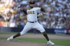 San Diego Padres relief pitcher Robert Suarez throws during the seventh inning in Game 2 of the baseball NL Championship Series between the San Diego Padres and the Philadelphia Phillies on Wednesday, Oct. 19, 2022, in San Diego. (AP Photo/Gregory Bull)