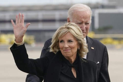 First lady Jill Biden waves as she and President Joe Biden walk to board Air Force One at John F. Kennedy International Airport, Monday, Oct. 31, 2022, in New York, after attending a private memorial service. (AP Photo/Manuel Balce Ceneta)