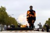 French President Emmanuel Macron stands at the Tomb of the Unknown Soldier during a ceremony at the Arc de Triomphe, as part of the commemorations marking the 104th anniversary of the Nov. 11, 1918 Armistice, ending World War I, Friday, Nov. 11, 2022 in Paris,. (Gonzalo Fuentes/Pool via AP)