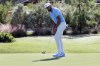 Tony Finau sinks a putt on the ninth green for birdie during the second round of the Houston Open golf tournament Friday, Nov. 11, 2022, in Houston. (AP Photo/Michael Wyke)