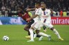 Nice's Jordan Lotomba challenges for the ball with Lyon' players during the French League One soccer match between Lyon and Nice, in Decines, outside Lyon, central France, Friday, Nov. 11, 2022. (AP Photo/Laurent Cipriani)