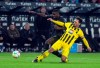 Monchengladbach's Marcus Thuram and Dortmund's Mats Hummels, right, battle for the ball during the Bundesliga soccer match between Borussia Monchengladbach and Borussia Dortmund at Borussia-Park, Monchengladbach, Germany, Friday Nov. 11, 2022. (Bernd Thissen/dpa via AP)