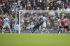Manchester City's Phil Foden, unseen in the frame , scores his side's first goal during the English Premier League soccer match between Manchester City and Brentford, at the Etihad stadium in Manchester, England, Saturday, Nov.12, 2022. (AP Photo/Dave Thompson)