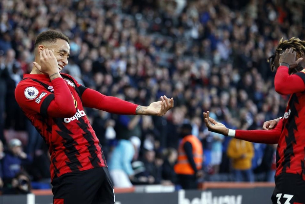Bournemouth's Marcus Tavernier, left, celebrates with teammates after scoring their side's first goal of the game during the Premier League match between Bournemouth and Everton at Vitality Stadium in Bournemouth, England, Saturday Nov. 12, 2022. (Steven Paston/PA via AP)