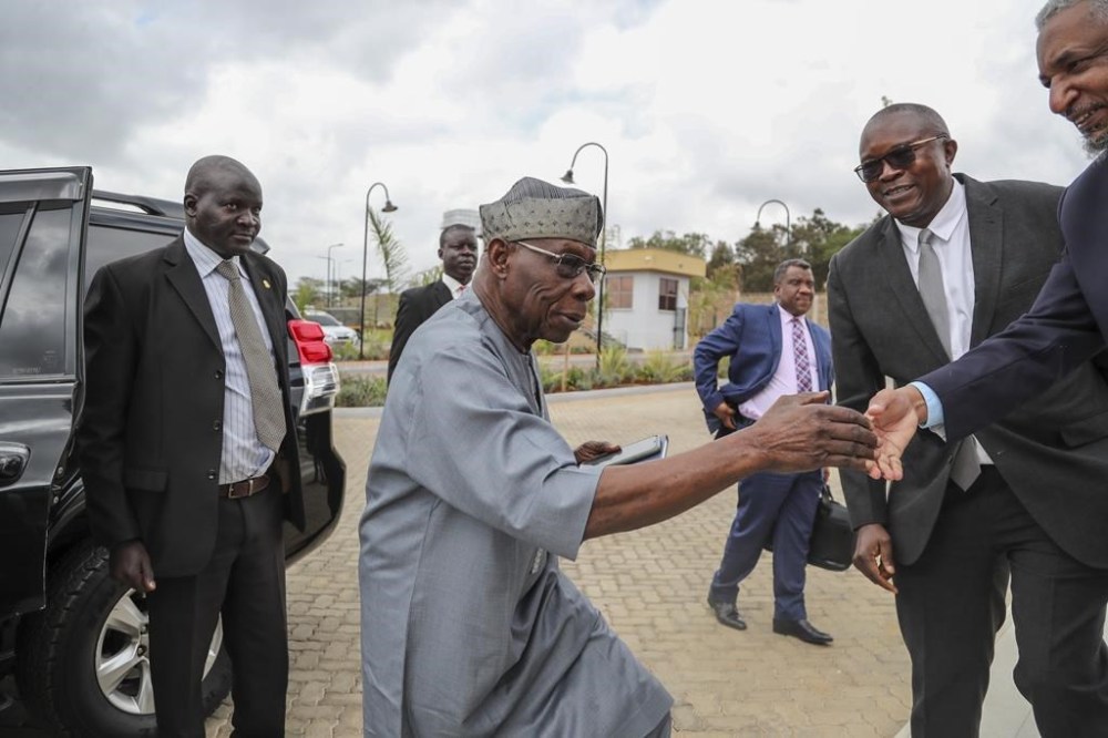 African Union envoy and former Nigerian president Olesegun Obasanjo, center, arrives for Ethiopian peace talks in Nairobi, Kenya Saturday, Nov. 12, 2022. A new round of ongoing talks aims to work out military and other details of last week's signing of a