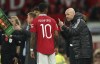 Manchester United's head coach Erik ten Hag, right, speaks to Manchester United's Marcus Rashford during the English League Cup third round soccer match between Manchester United and Aston Villa in Manchester, England, Thursday, Nov. 10, 2022. (AP Photo/Dave Thompson)