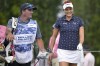 Lexi Thompson, right, has a laugh while walking to the third tee with her caddie during the final round of the LPGA Pelican Women's Championship golf tournament at Pelican Golf Club, Sunday, Nov. 13, 2022, in Belleair, Fla. (AP Photo/Phelan M. Ebenhack)