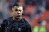 PSG's Kylian Mbappe looks on during warm up before the French League One soccer match between FC Lorient and Paris Saint-Germain at the Moustoir stadium in Lorient, western France, Sunday, Nov. 6, 2022. (AP Photo/Jeremias Gonzalez)