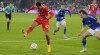 Bayern's Jamal Musiala, left, passes the ball with the hoe to teammate Gnabry (not in the picture, scoring the opening goal during the German Bundesliga soccer match between FC Schalke 04 and Bayern Munich in Gelsenkirchen, Germany, Saturday, Nov. 12, 2022. (AP Photo/Martin Meissner)