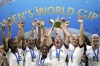 FILE - United States' Megan Rapinoe lifts up the trophy after winning the Women's World Cup final soccer match between US and The Netherlands at the Stade de Lyon in Decines, outside Lyon, France, in July 7, 2019. (AP Photo/Alessandra Tarantino, File)