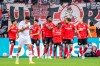 Leverkusen's players celebrate the opening goal during the German Bundesliga soccer match between Bayer 04 Leverkusen and VfB Stuttgart in Leverkusen, Germany, Saturday, Nov. 12, 2022. (David Inderlied/dpa via AP)