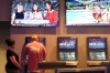 People make sports bets at the Ocean Casino Resort in Atlantic City, N.J., on Sept. 6, 2022. Americans will bet $1.8 billion on soccer's World Cup this year, according to the casino industry's national trade group. The American Gaming Association estimated Tuesday, Nov. 15, 2022, that nearly three-quarters of those who bet plan to do so online, with a bookie or at a physical sportsbook. (AP Photo/Wayne Parry)