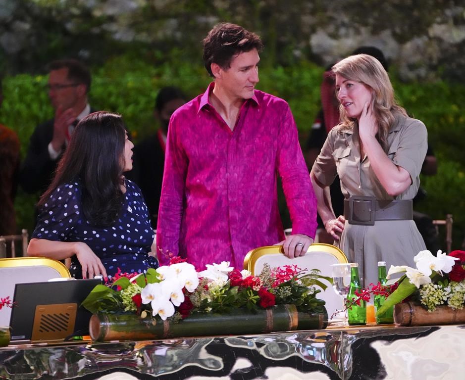 Prime Minister Justin Trudeau talks with Minister of Foreign Affairs Melanie Joly, right, and Minister of International Trade, Export Promotion, Small Business and Economic Development Mary Ng during the G20 Leaders' Dinner at the Garuda Wisnu Kencana Cultural Park, in Badung, Bali, Indonesia on Tuesday, Nov. 15, 2022, during the G20 Leaders Summit. THE CANADIAN PRESS/Sean Kilpatrick